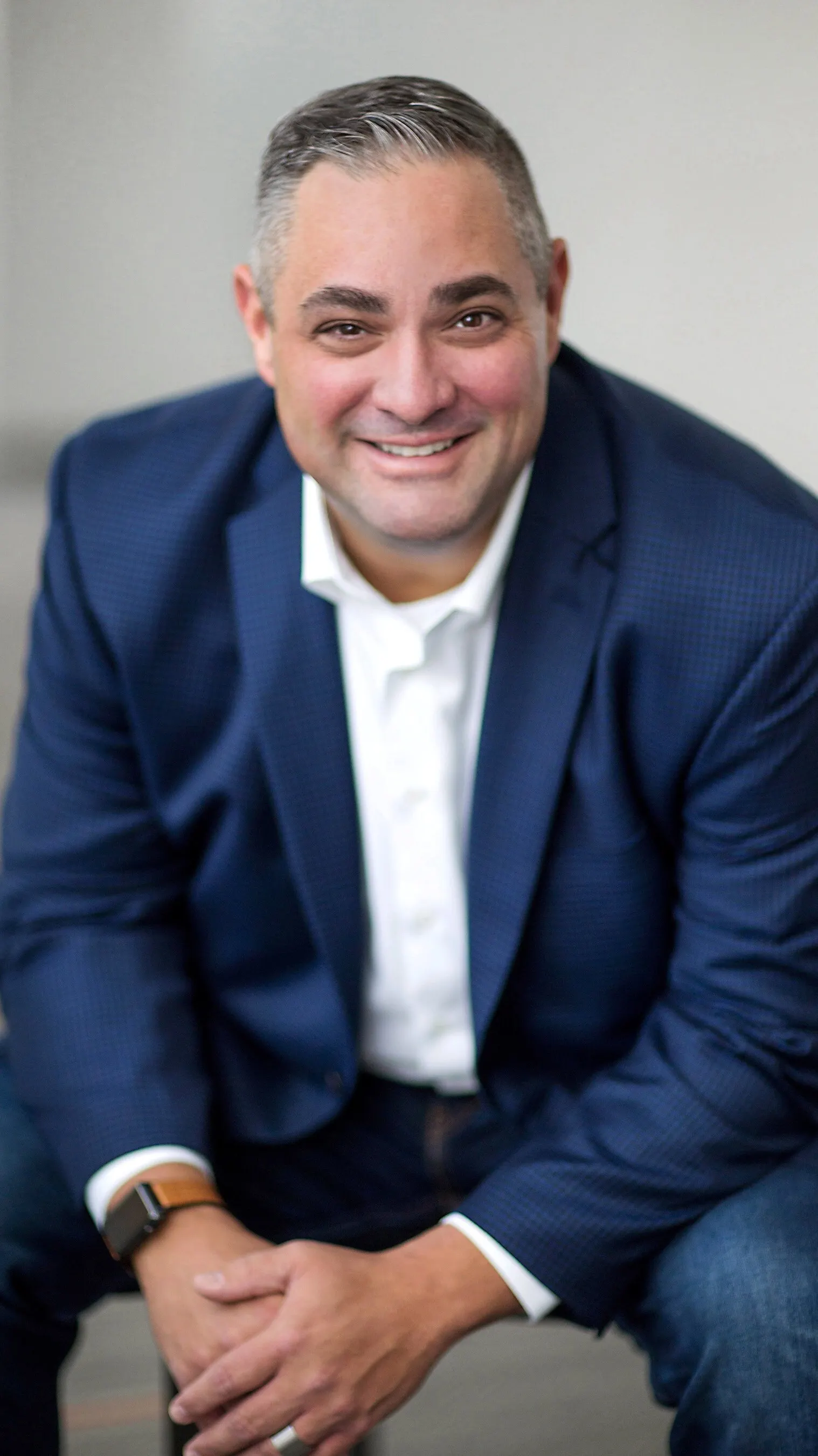 A professional headshot.