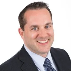 A headshot of Welch&#x27;s CMO Scott Utke wearing a dark suit and tie against a white background