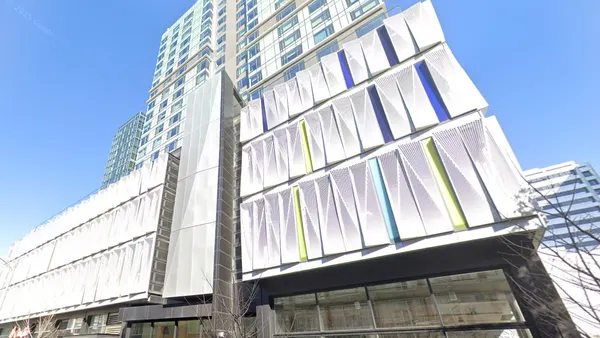 Street view looking up at apartment tower