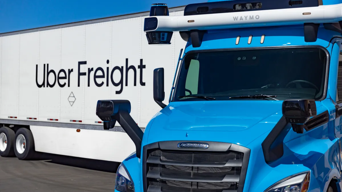 A Waymo Via autonomous truck pulls an Uber Freight trailer.