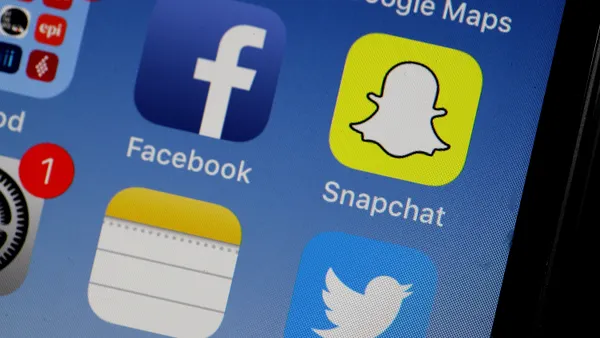 The Snapchat app is displayed on the home screen of an iPhone.