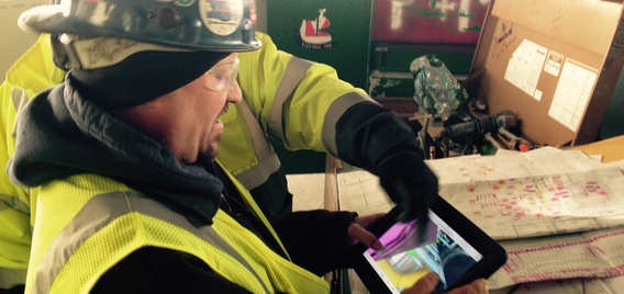 Construction worker using tablet photo