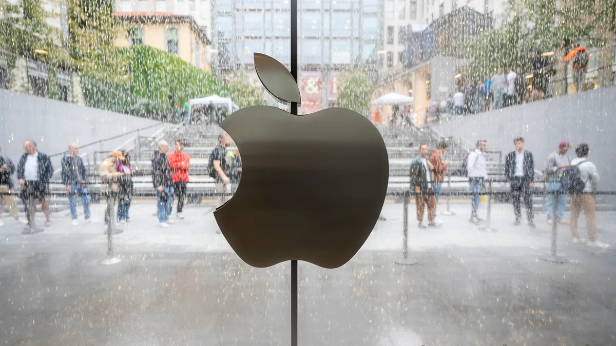 Customers queue outside the Apple Store in Milan on September 22, 2023 in Milan, Italy.