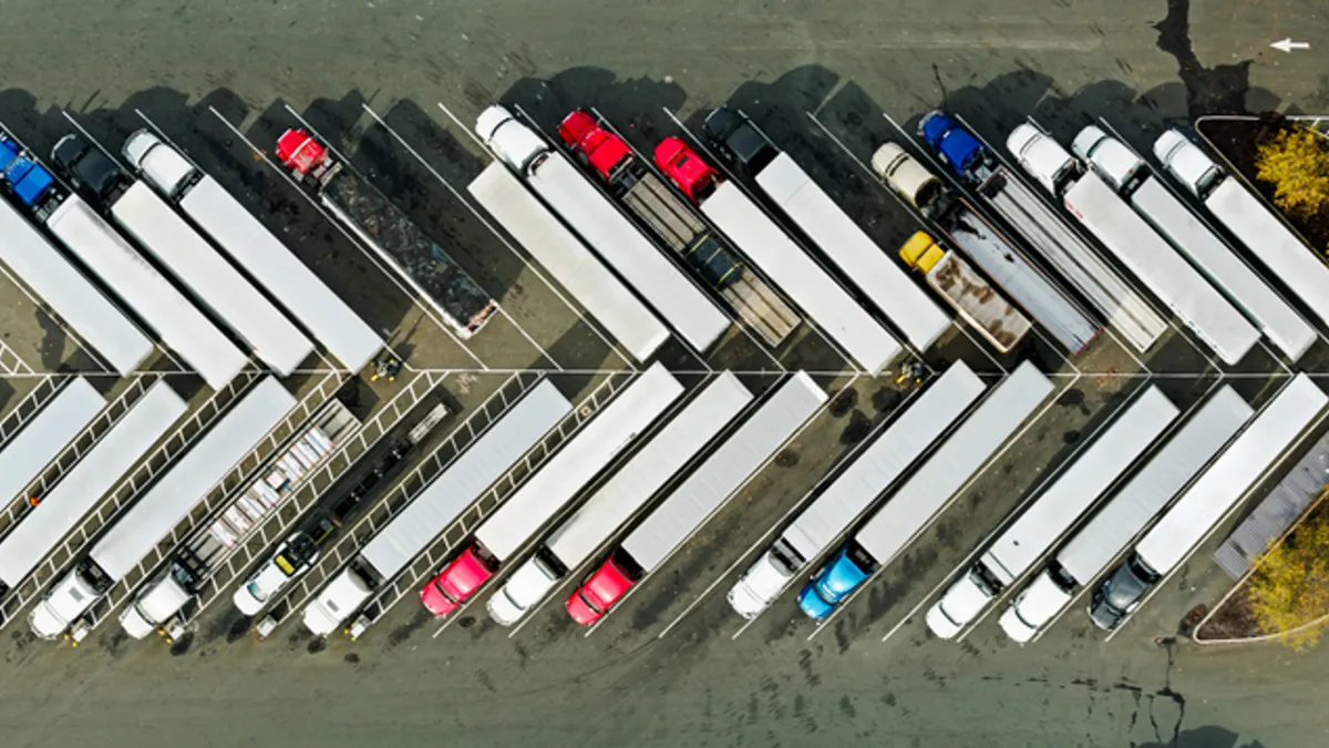 Trucks are lined up in diagonal rows.