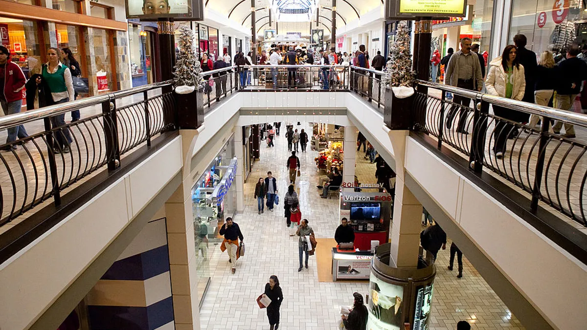 Shoppers walk through a mall during the holiday season.