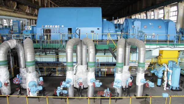 Industrial equipment sits inside a building.