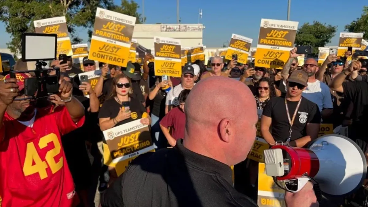 UPS employees participate in a practice picket.