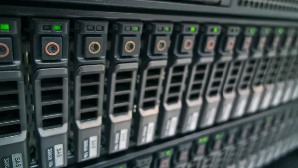 An image of computer servers in a large data center.