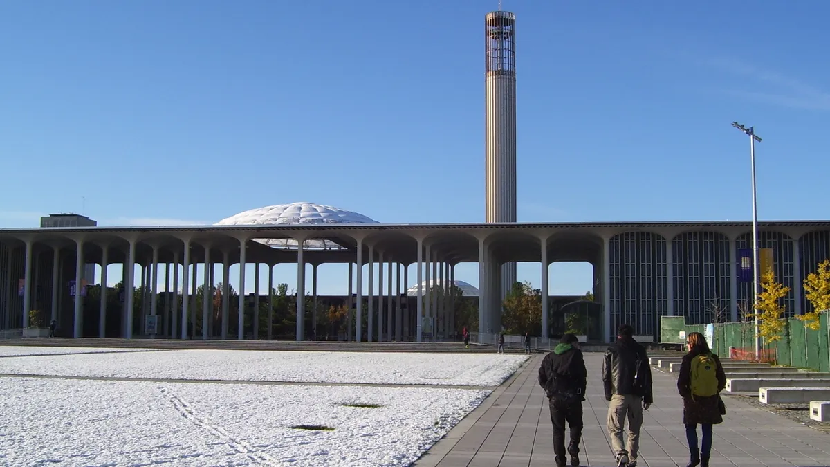 Students approaching the Academic Podium at the University at Albany.