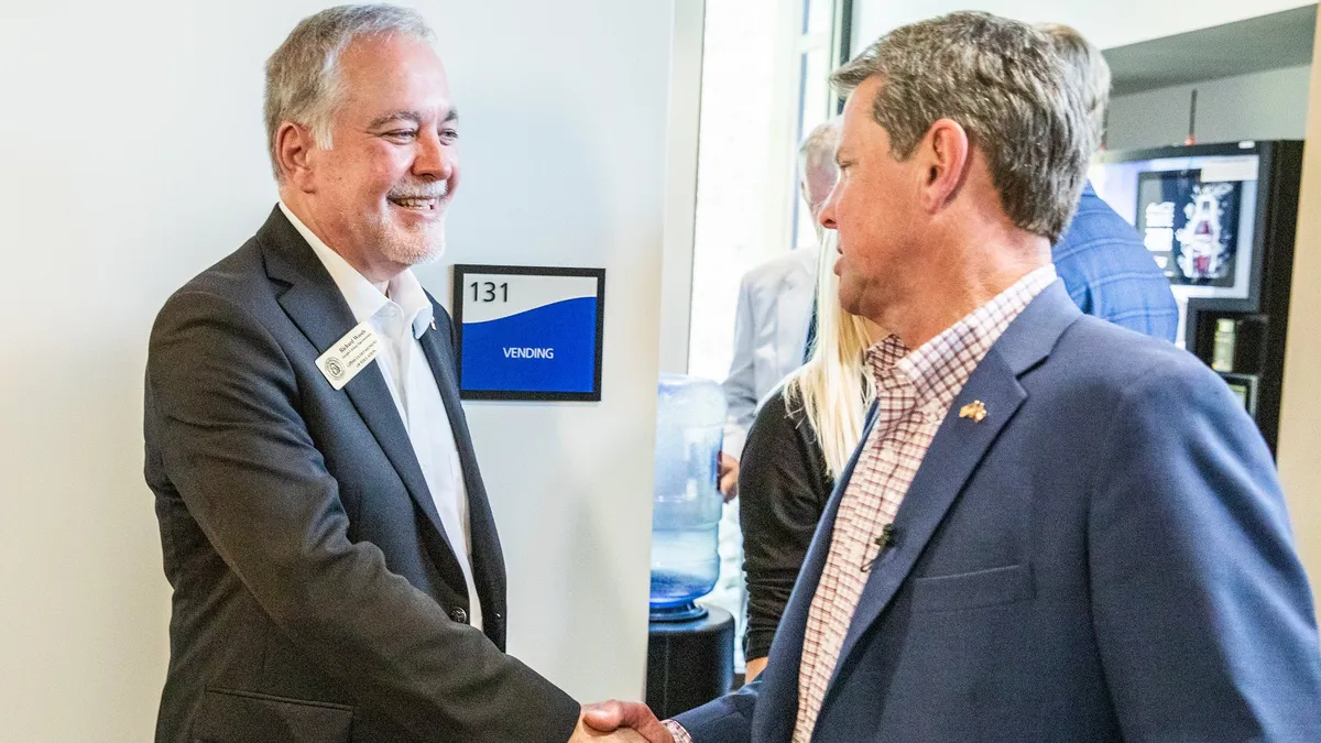 Georgia Superintendent Richard Woods and Gov. Brian Kemp shake hands