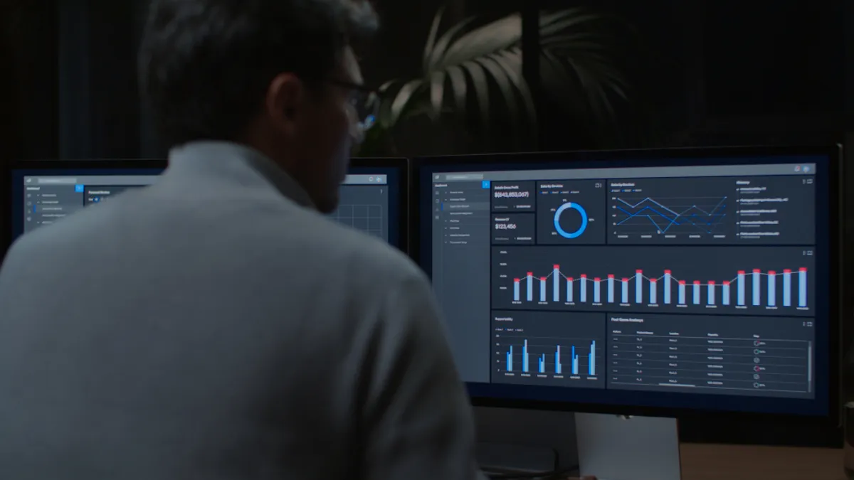 Infometrics on monitor with man looking