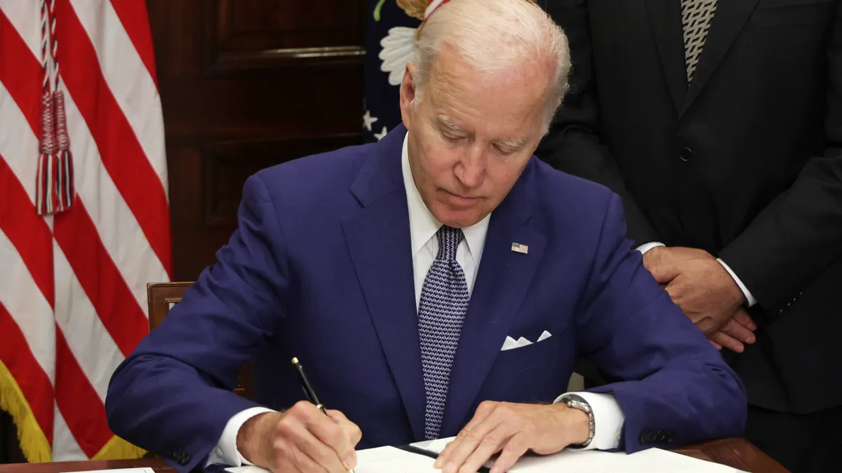 U.S. President Joe Biden signs an executive order in Washington, D.C.