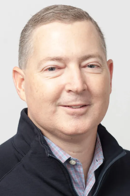 Headshot of Steffan Tomlinson, CFO of Stripe