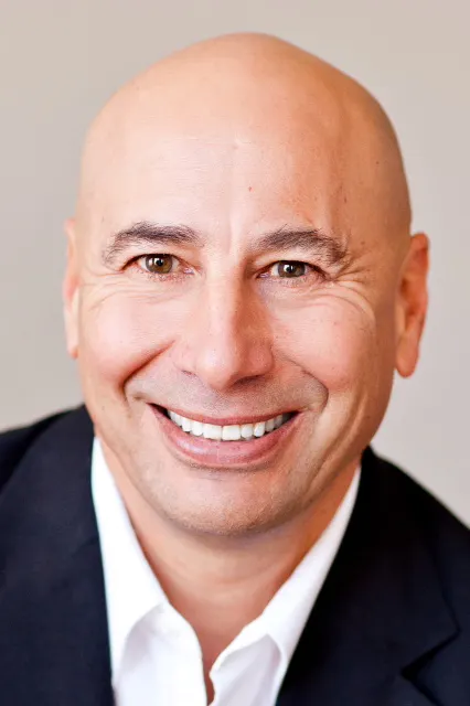 Headshot of Dean Kaplan, president of The Kaplan Group