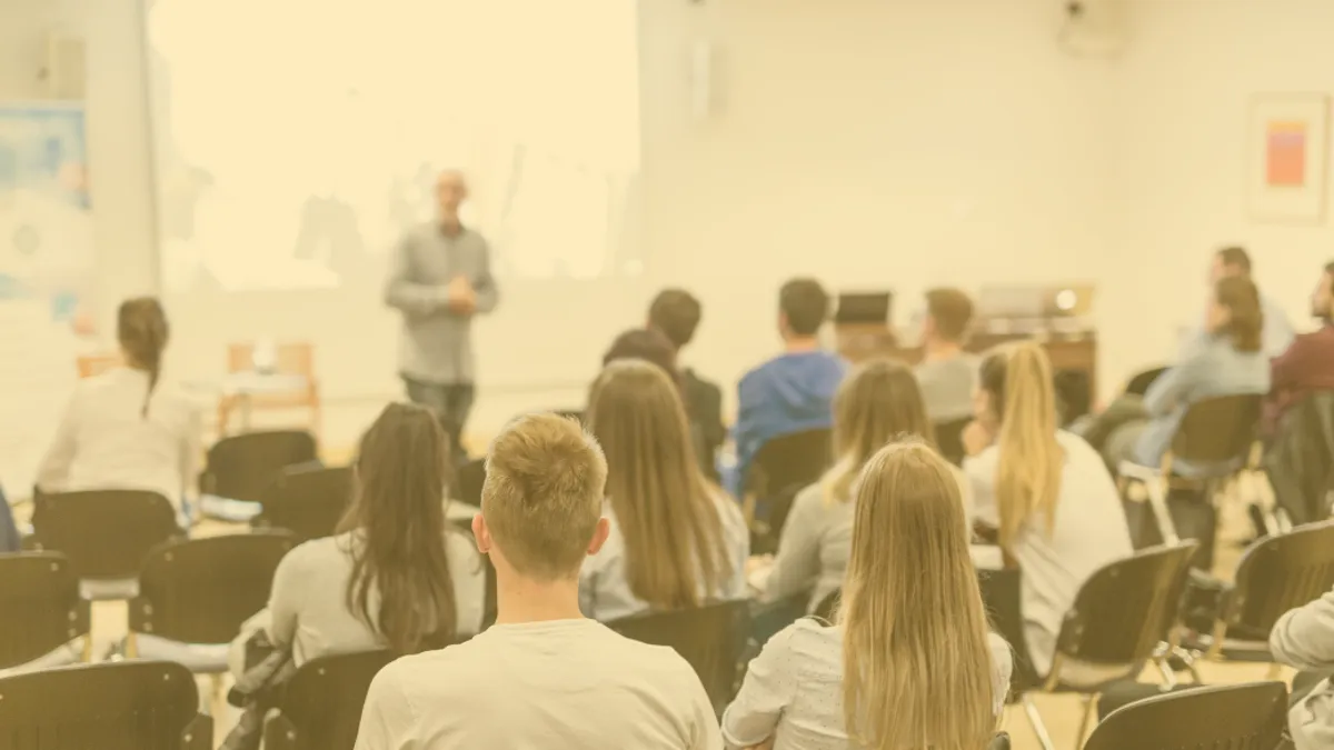 Students sitting in a classroom.