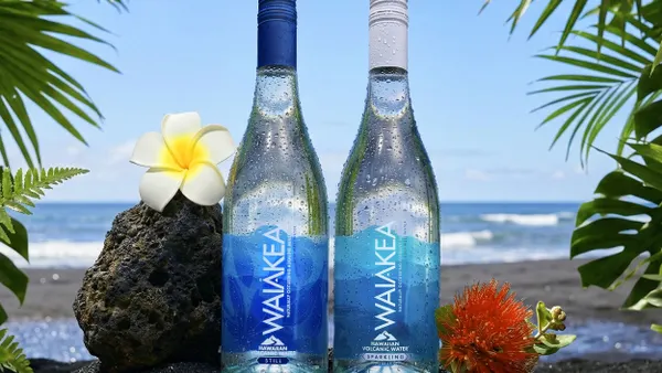 Two clear glass bottles of water with branding for Waiākea Hawaiian Volcanic Beverages.