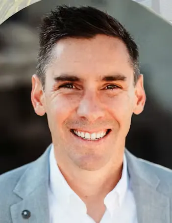 A professional headshot of Bo Chapman.