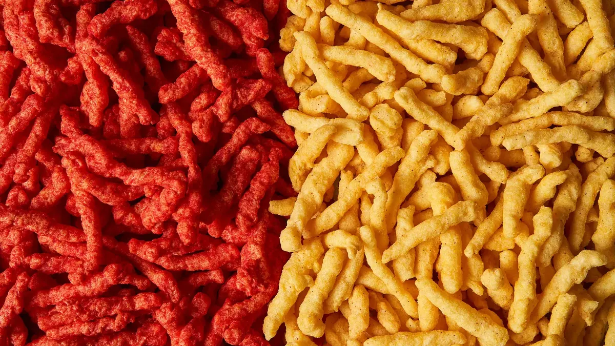 Cheetos Flamin’ Hot without artificial dyes next to their traditional counterparts