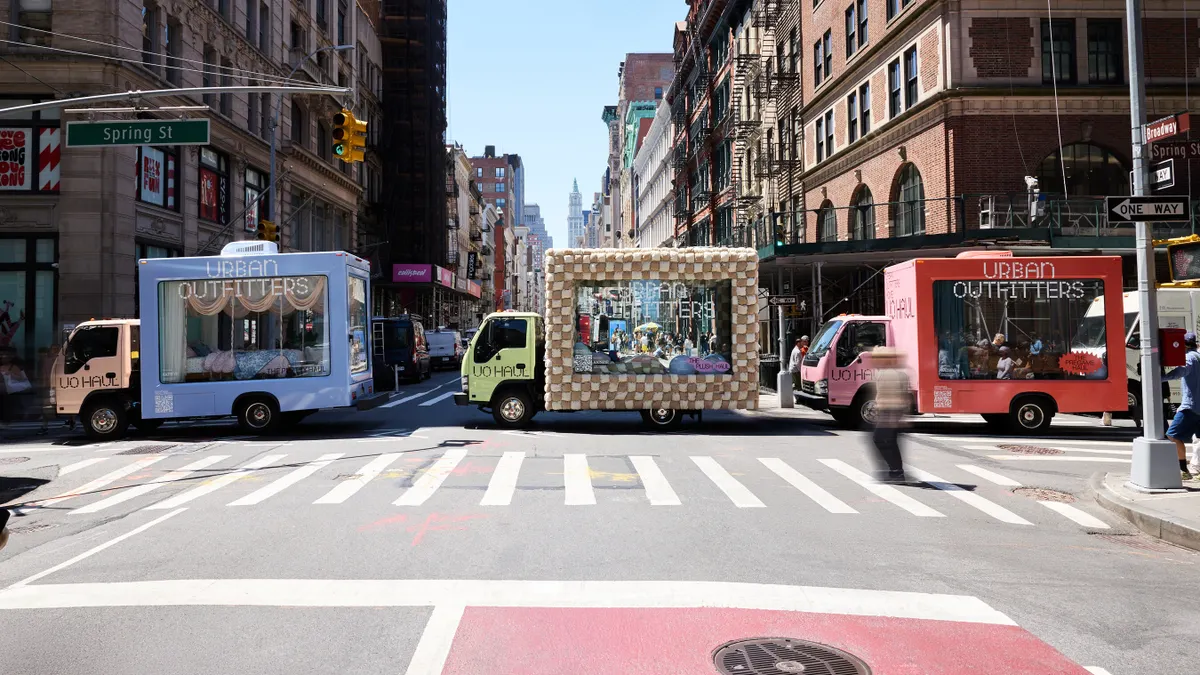 A trio of trucks with see-through glass displays hit the streets of Manhattan as part of Urban Outfitters' back-to-school campaign.