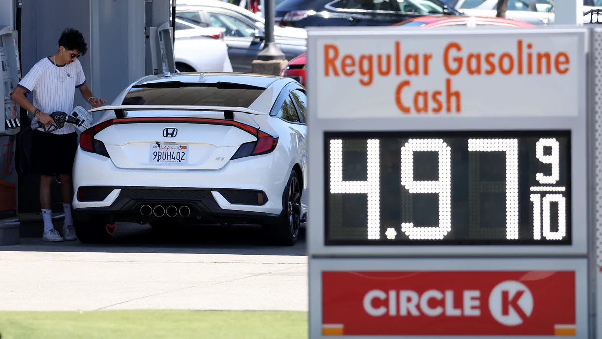 A customer pumping gas.