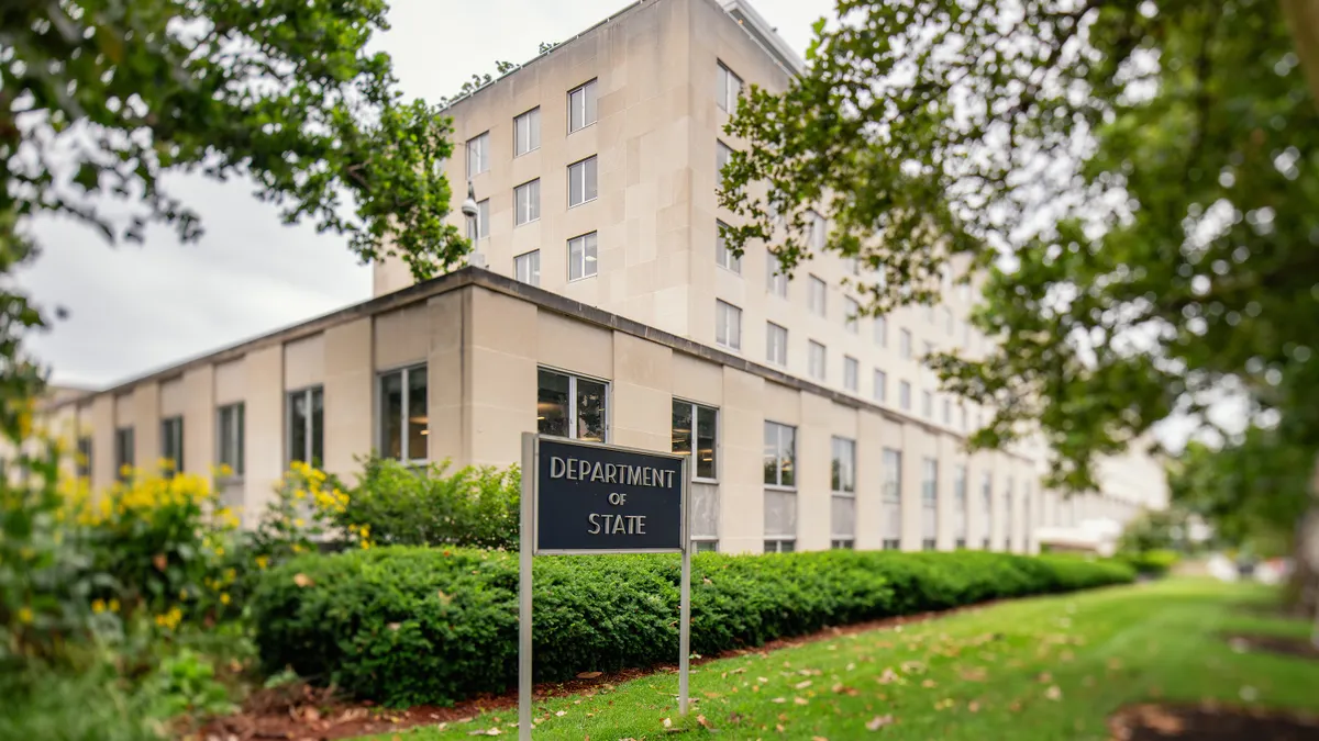A sign reading "Department of State" sits outside the U.S. State Department headquarters in Washington, D.C.