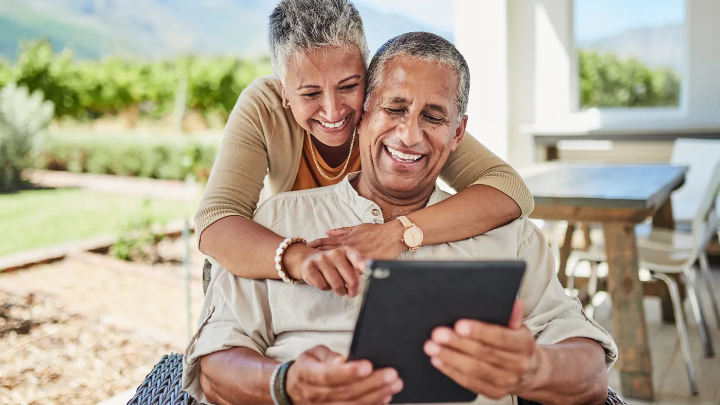 two people looking at tablet