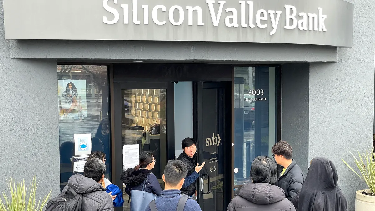 People gather outside Silicon Valley Bank.