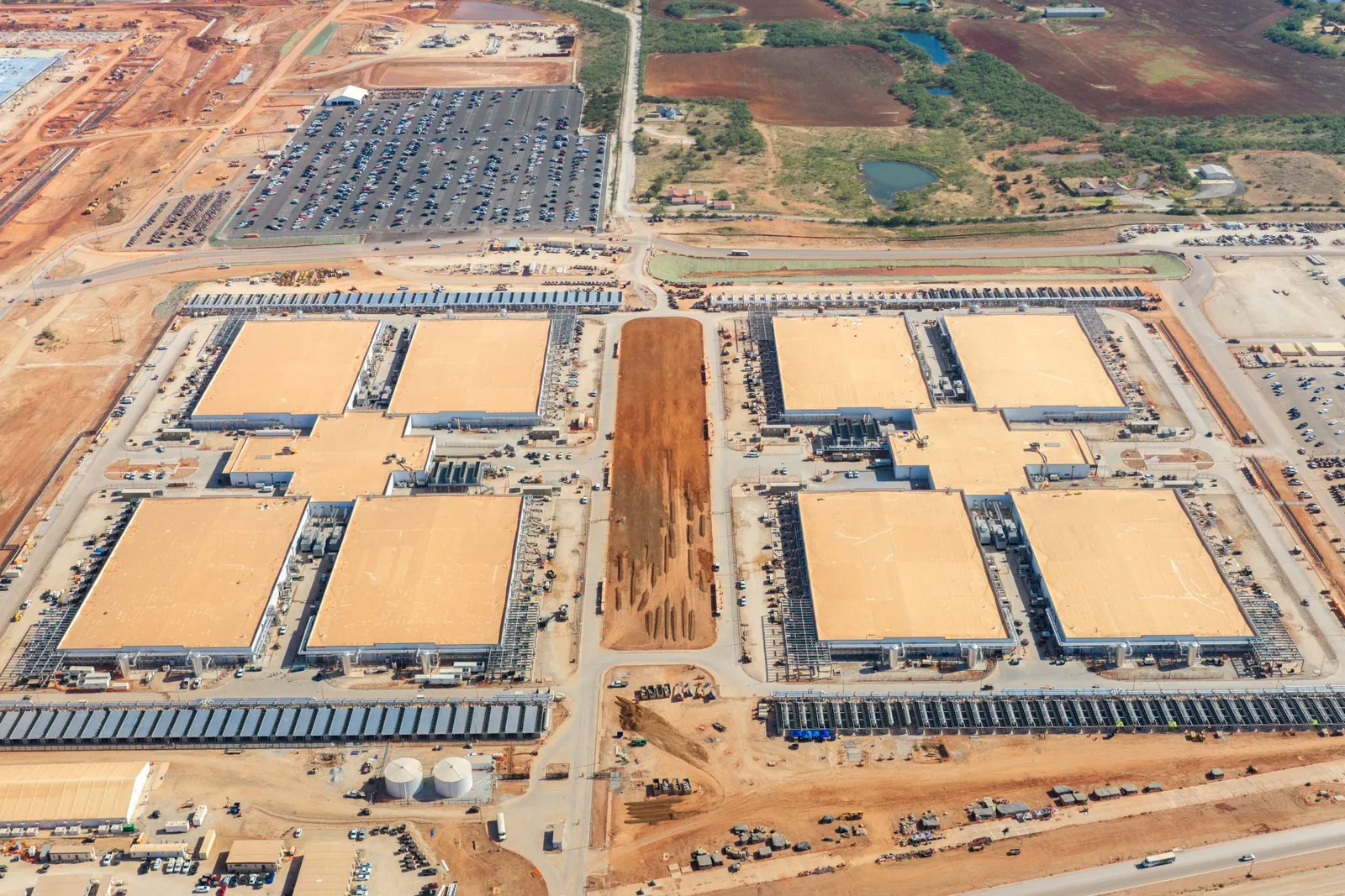 A large data center campus under construction in a desert