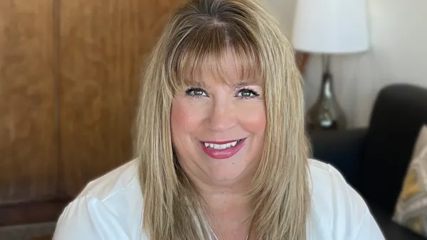 Baxter's Heather Knight is pictured with a lamp and sofa in the background.