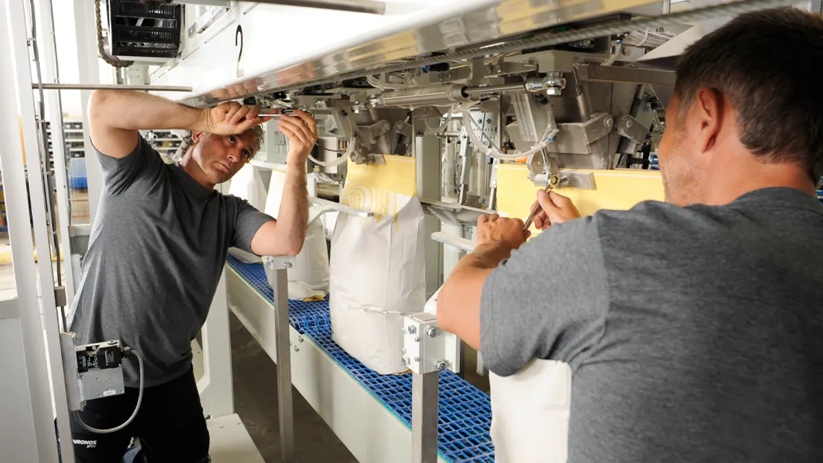 Two men working