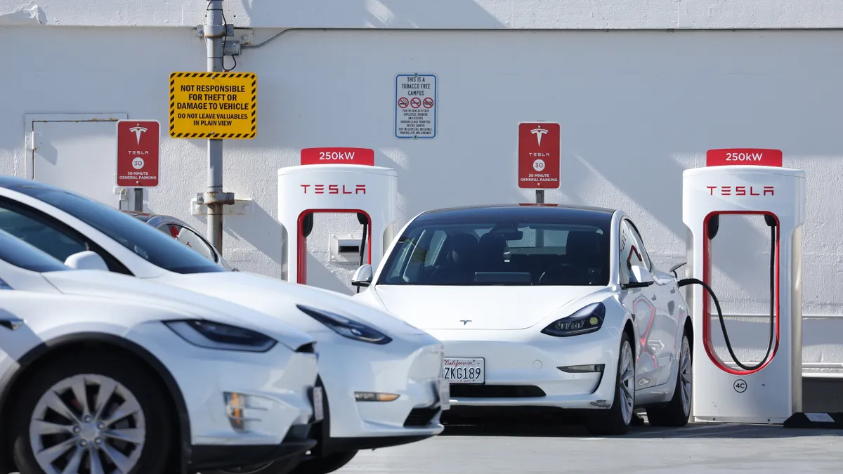 An electric vehicle at a Tesla EV charging station.