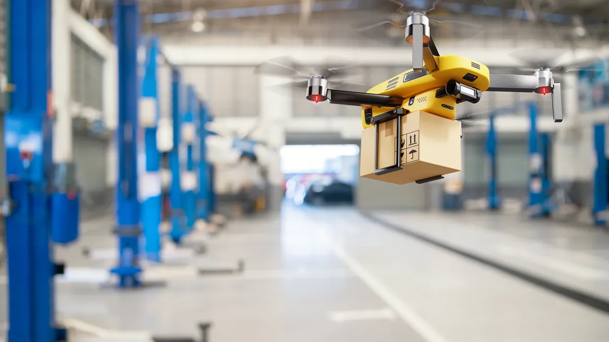 Flying delivery drone transferring parcel box from distribution warehouse to automotive garage customer service repair center background. Modern innovative technology and gadget concept.