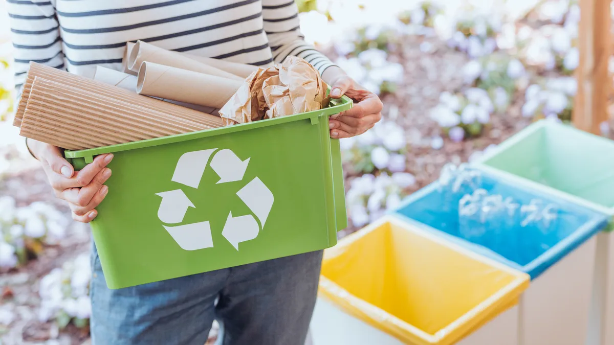 Person sorting paper waste