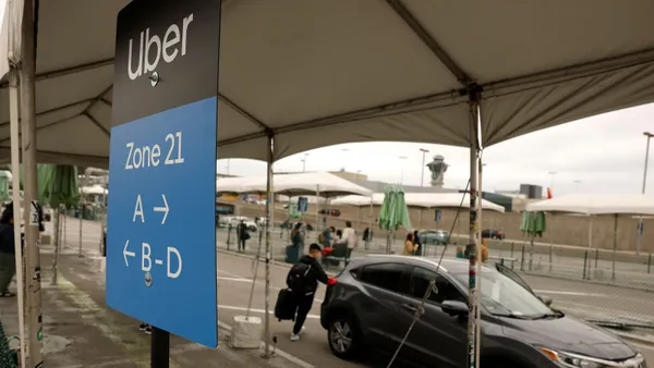 Uber customer gets into a car at Los Angeles International Airport on March 10, 2026