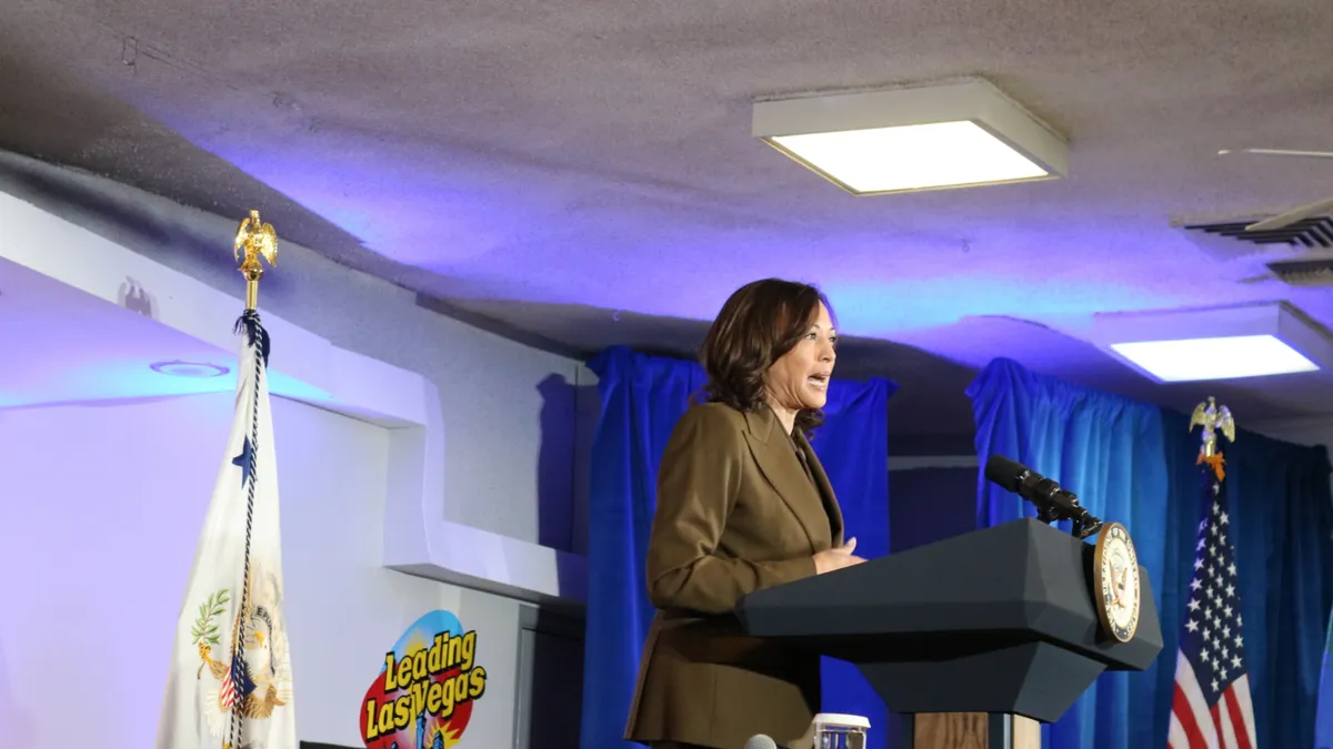 Vice President Kamala Harris speaks at a podium.