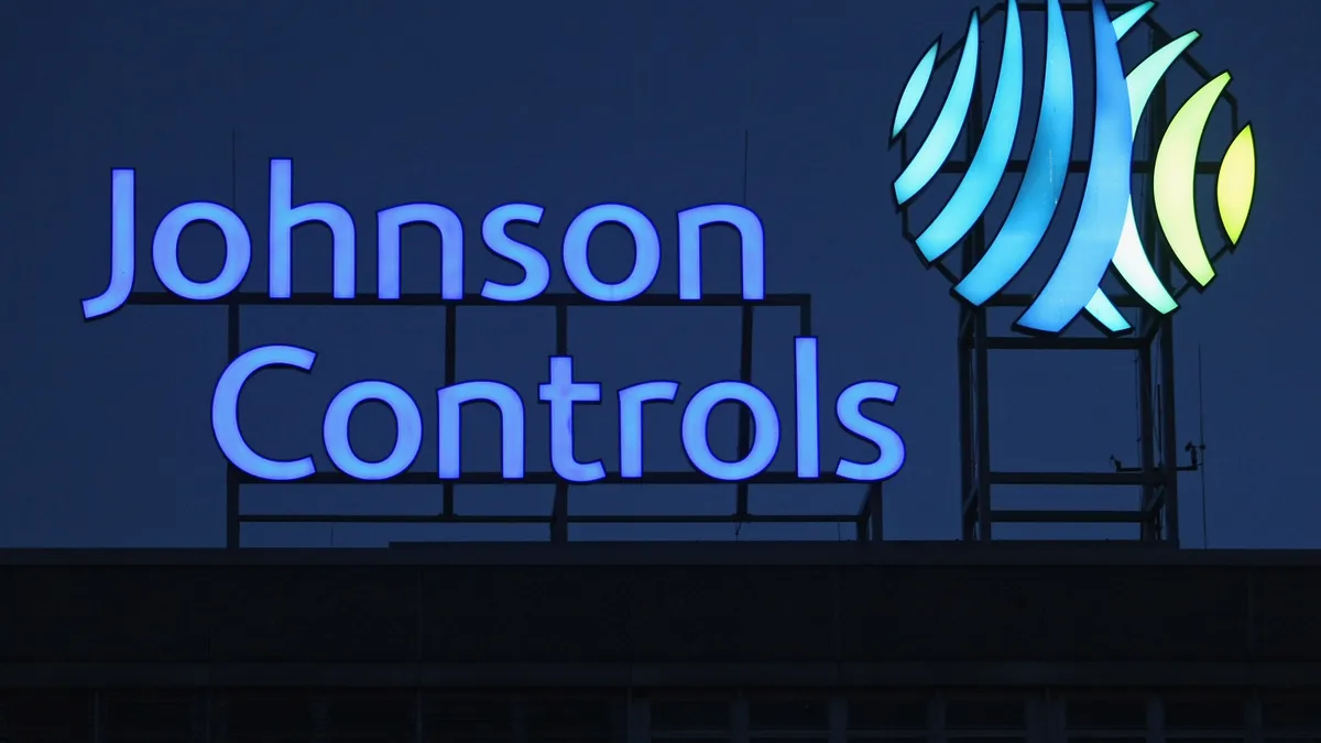 Johnson Controls logo above a production plant in Hanover, Germany.