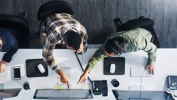 Agents working across desks.