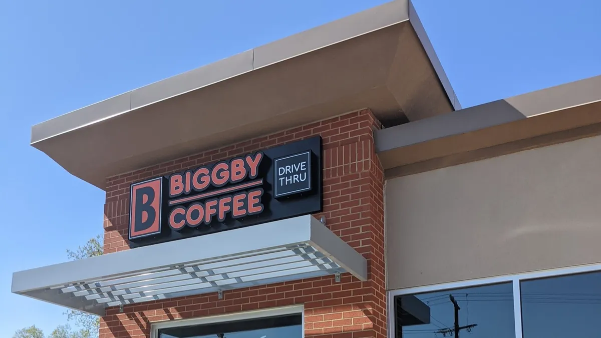 An image of a small brick restaurant with Biggby signage