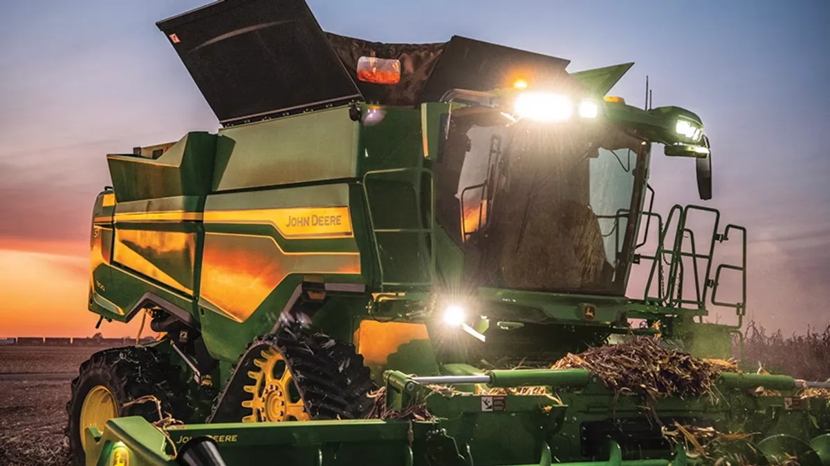 John Deere farm equipment is seen in a field