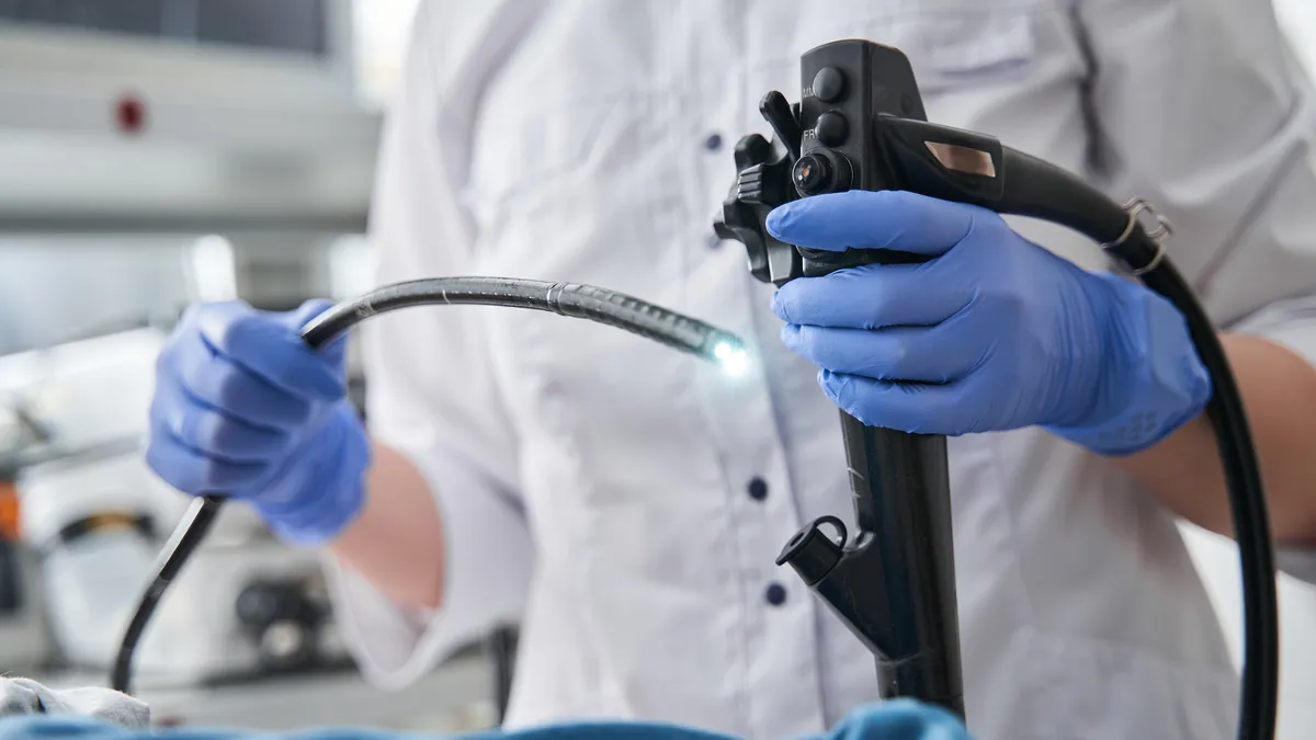 A physician holding and endoscope