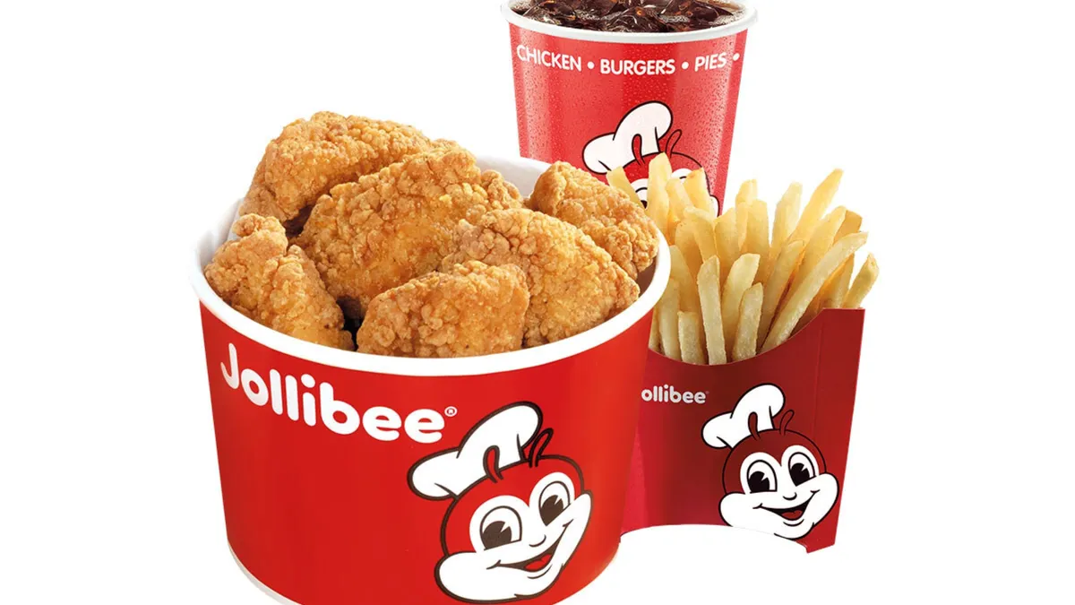 A bunch of chicken nuggets, a drink and a side.