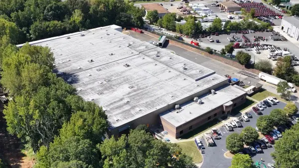 An aerial photo of a recycling facility surrounded by plains and trees.