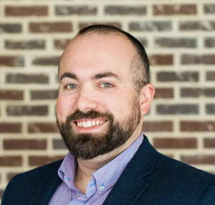 Headshot of a man in suit