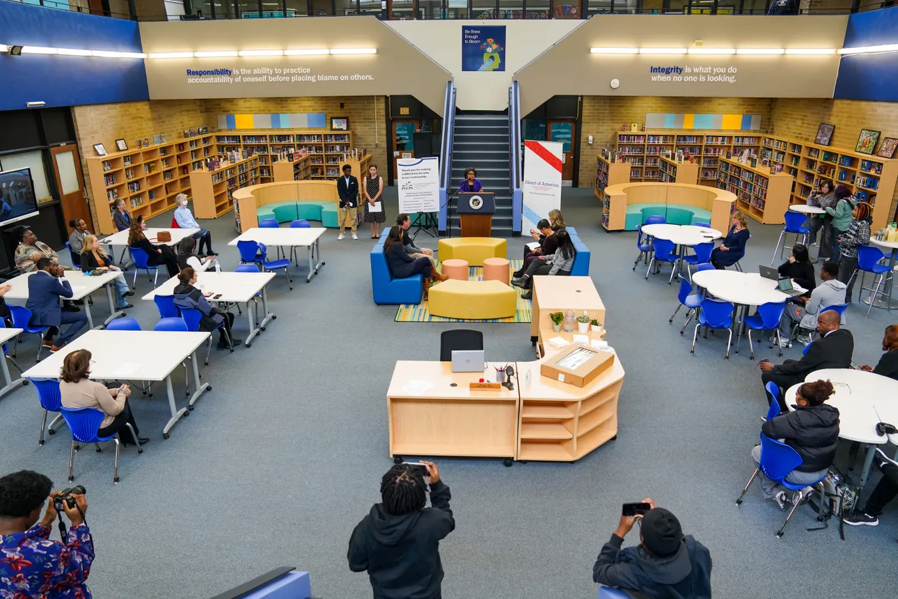 An aerial view of a school library renovation ceremony