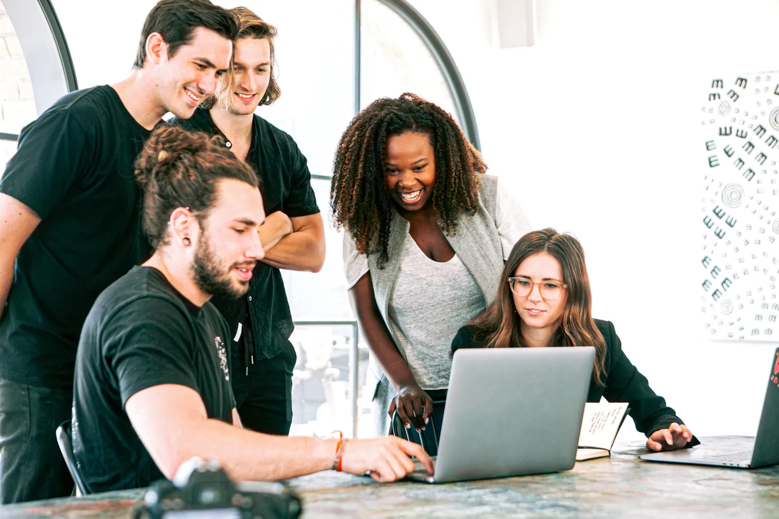 A multiethnic group of colleagues work together