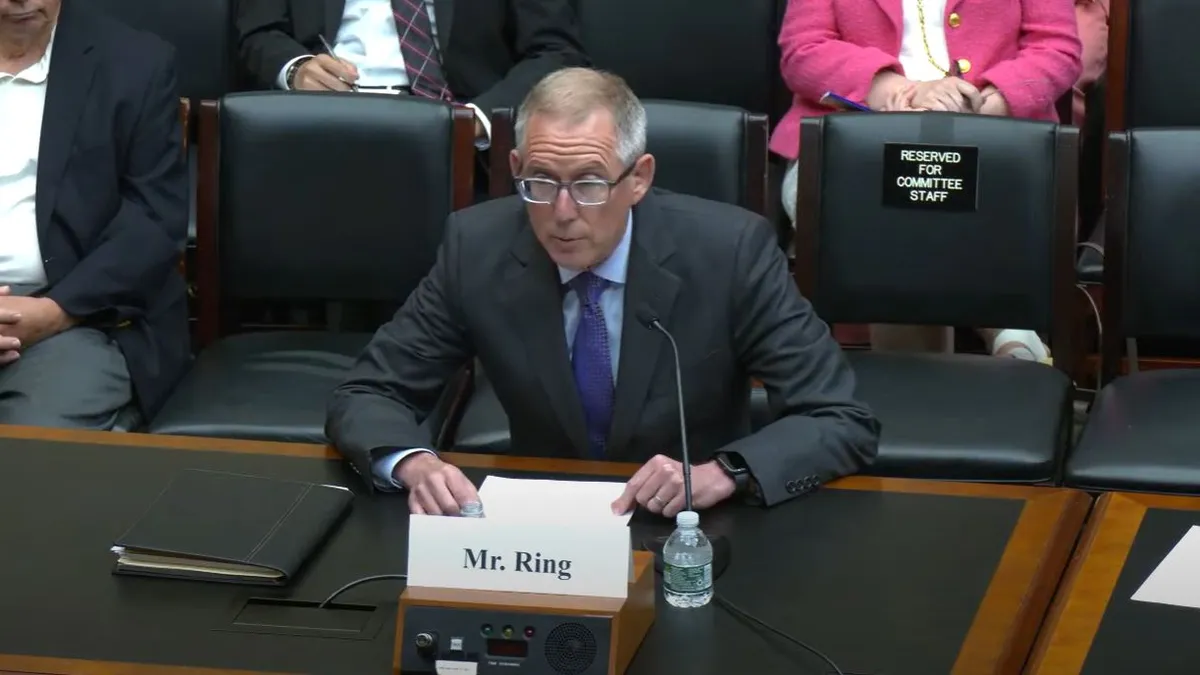 John Ring, former chairman of the National Labor Relations Board, gives testimony during a Congressional committee hearing.