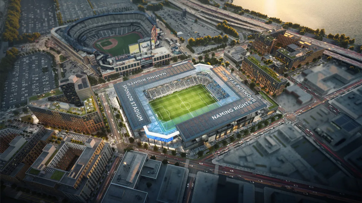 An overhead view of a cityscape with two stadiums.