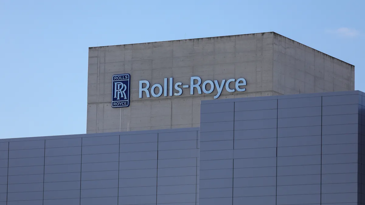 Front view of the facade of a test facility building bearing the Rolls-Royce logo.