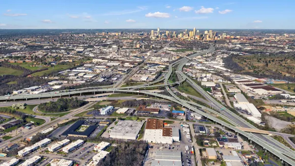 An aerial shot of a network of roads that snake over and around each other.