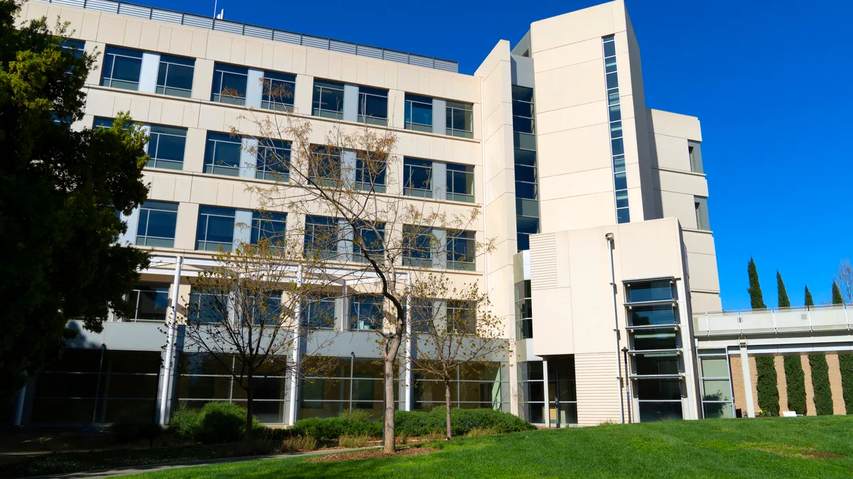 A modern white building on an American college campus.